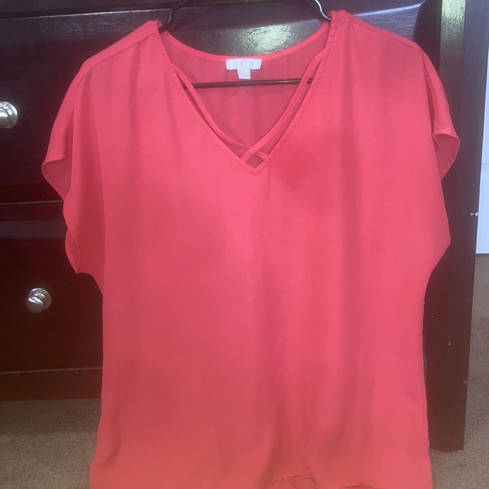 Pinkish orange cross on chest tee